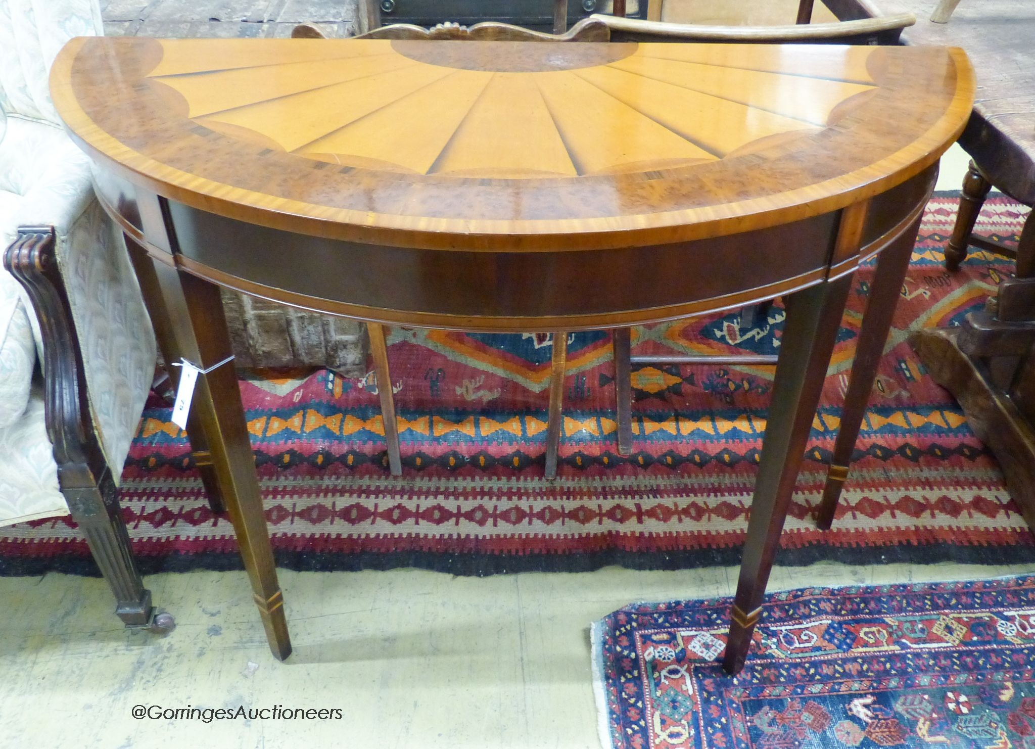 A reproduction Sheraton style inlaid satinwood D shaped consul table, length 114cm, depth 49cm, height 84cm